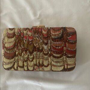 Judith Leiber Red and Brown Clutch with Luxurious Appeal